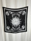 Black square scarf with sun and moon design on a white background